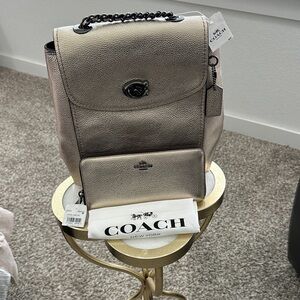 Coach Backpack w/matching wallet in metallic gold and gunmetal hardware.